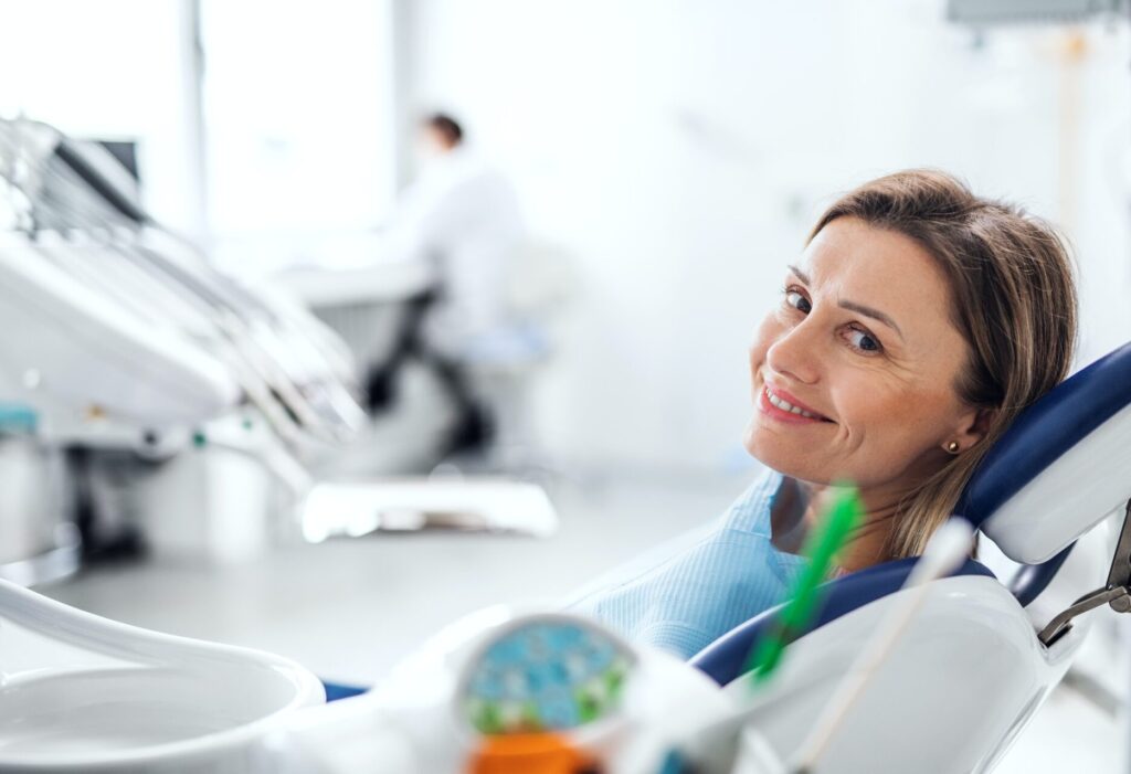 A woman has a dental check-up in dentist surgery