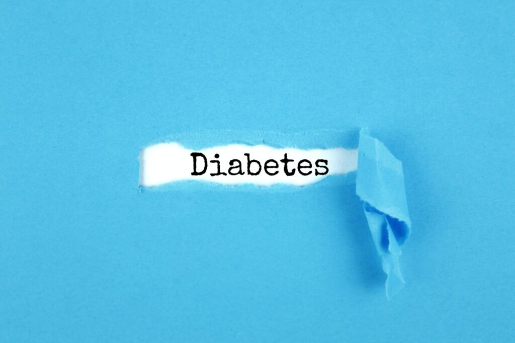Blue torn paper written with inscription diabetes