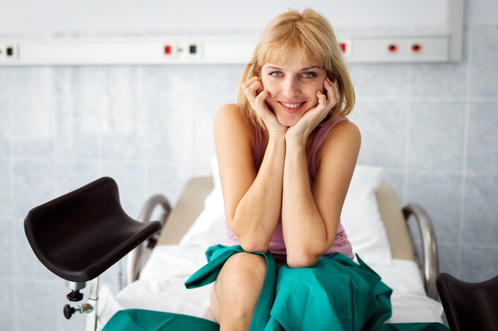 Gynecology examination and consultation. Happy woman at hospital