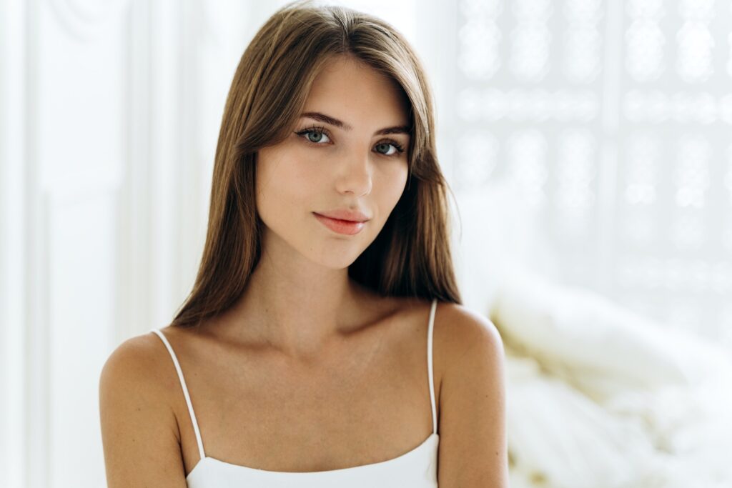 Portrait of the pretty young caucasian woman seducing by her appearance while posing