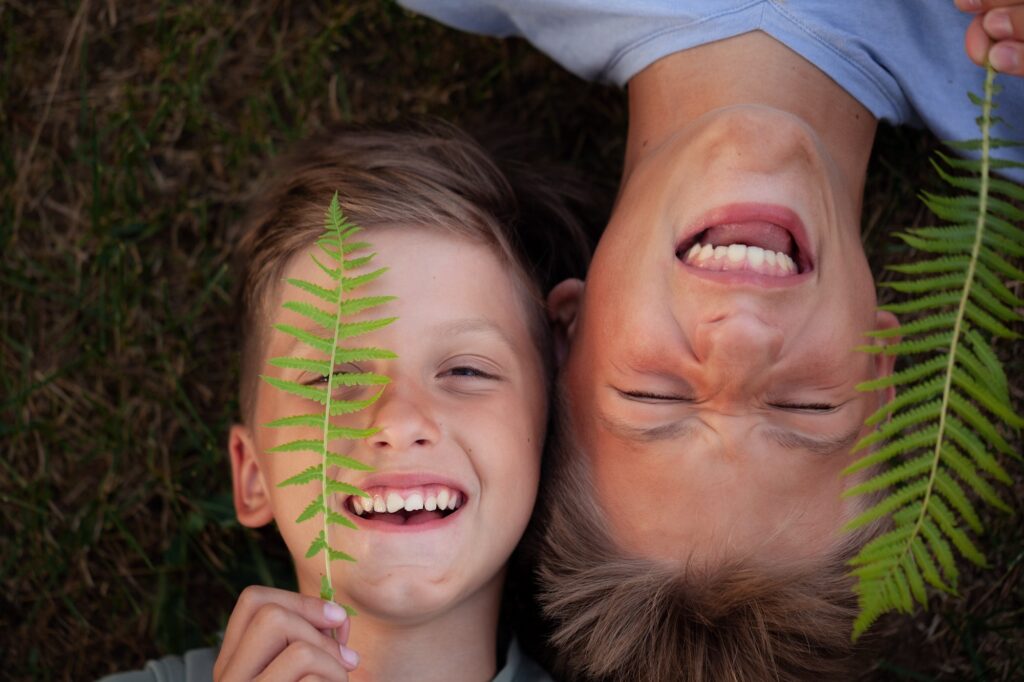 Cheerful kids laughing together. Having fun.