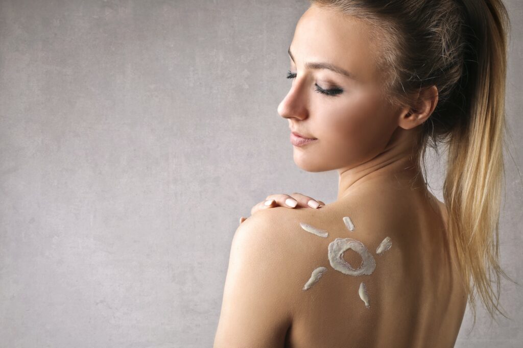 Portrait of a girl with a sun on her skin