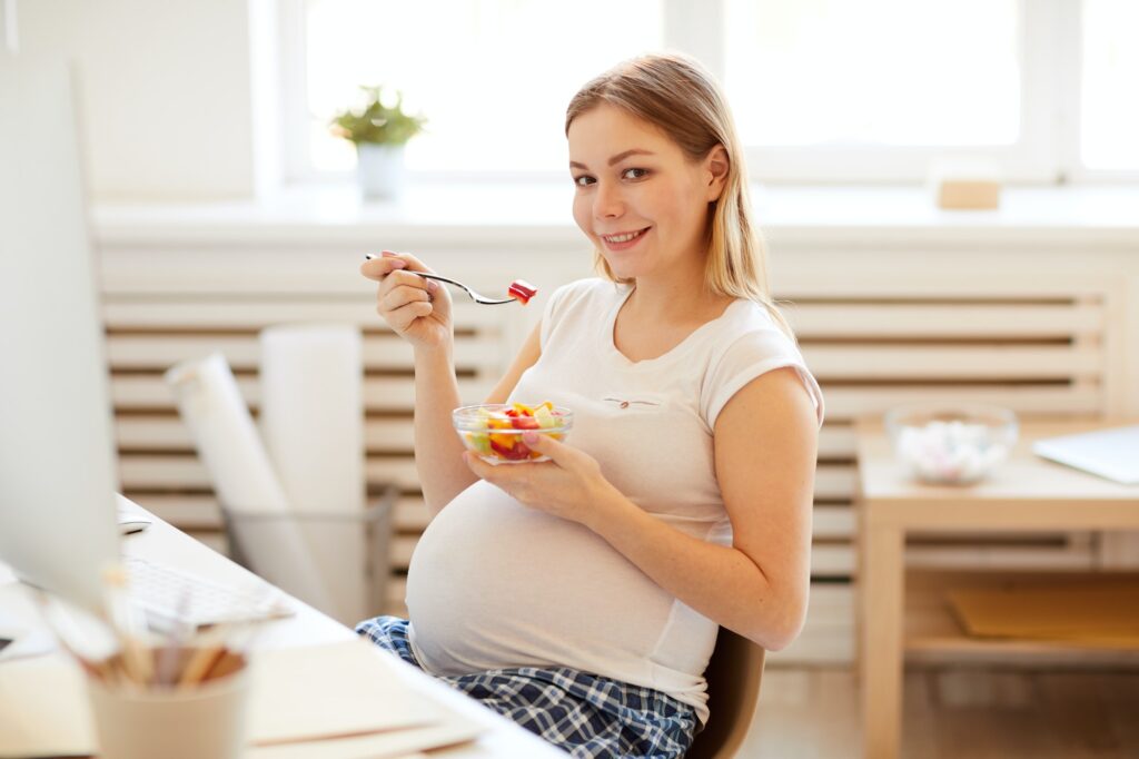 Pregnant Woman Eating Salad