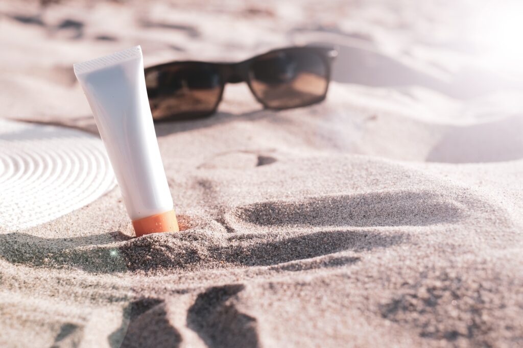 sun protection beauty sunscreen on the beach.