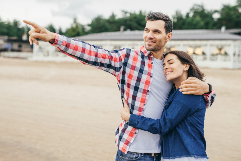Woman and man embrace.