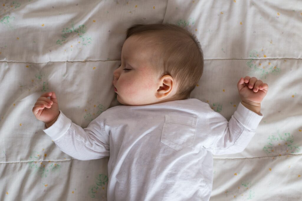 Baby sleeping in bed