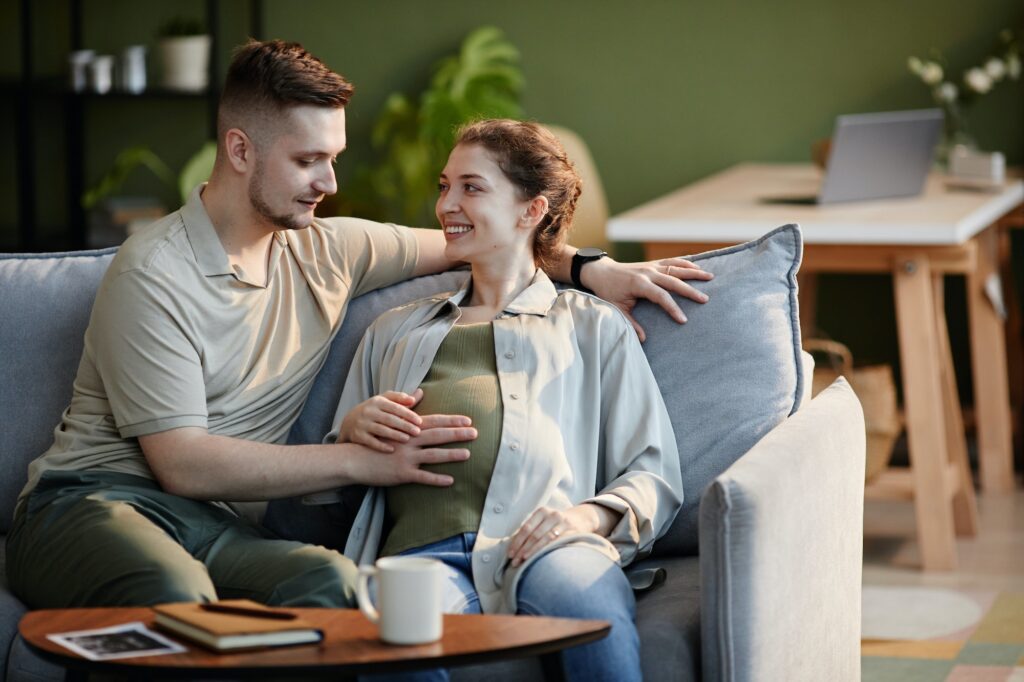 Happy couple enjoying pregnancy together