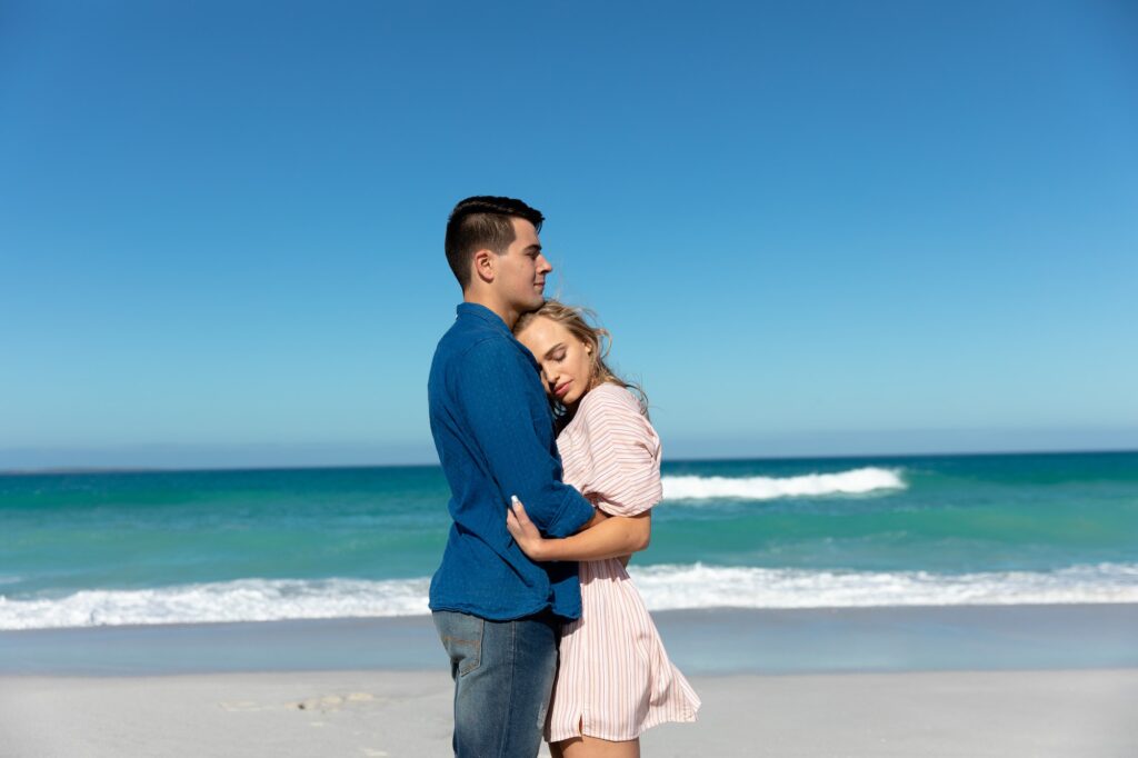 Young couple hugging at the beach