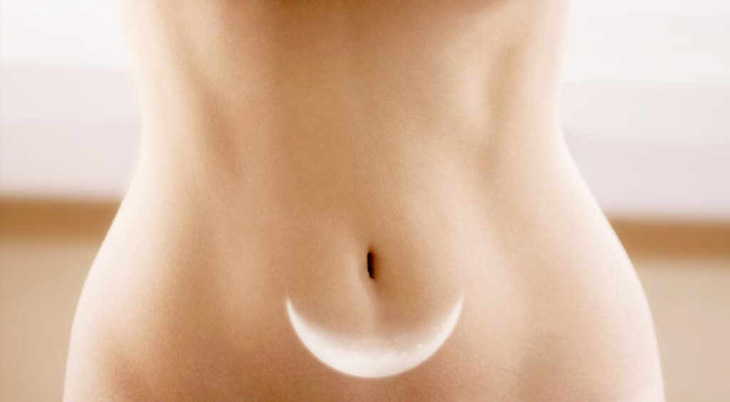 Female stomach with moon multiple exposure image. Menstruation and woman health