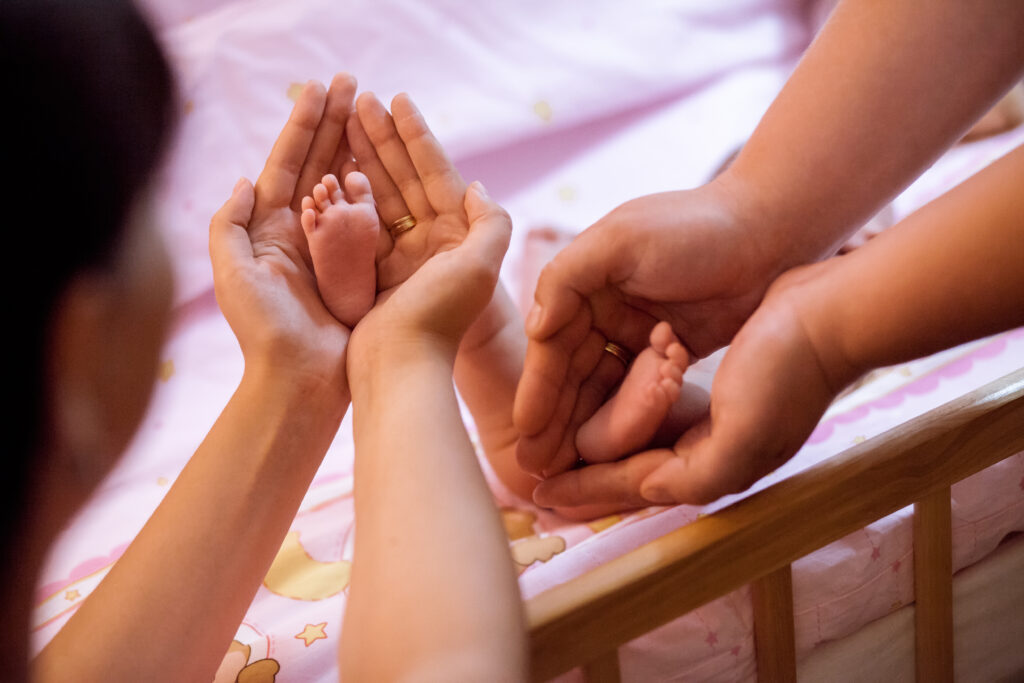 newborn baby with mother and father