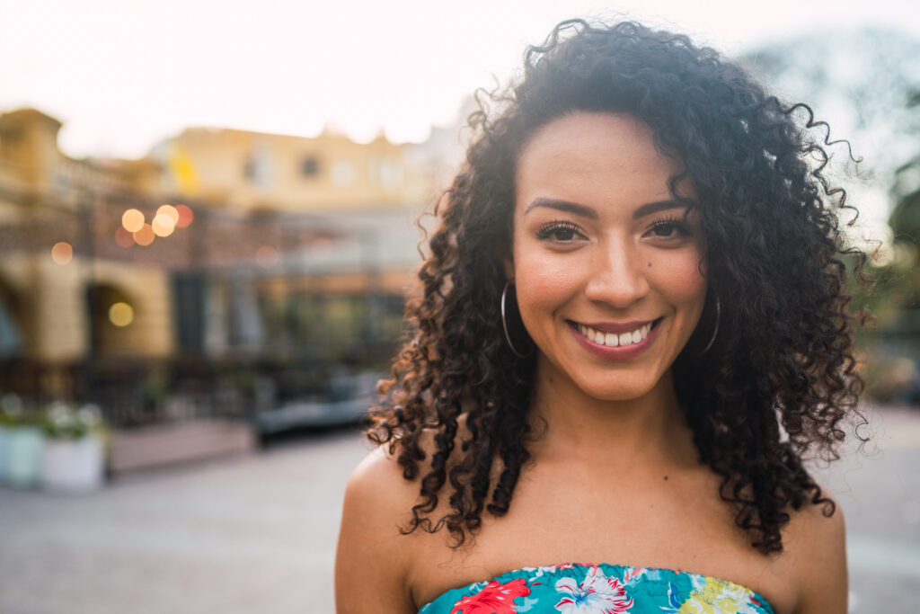 Portrait of confident woman laughing.