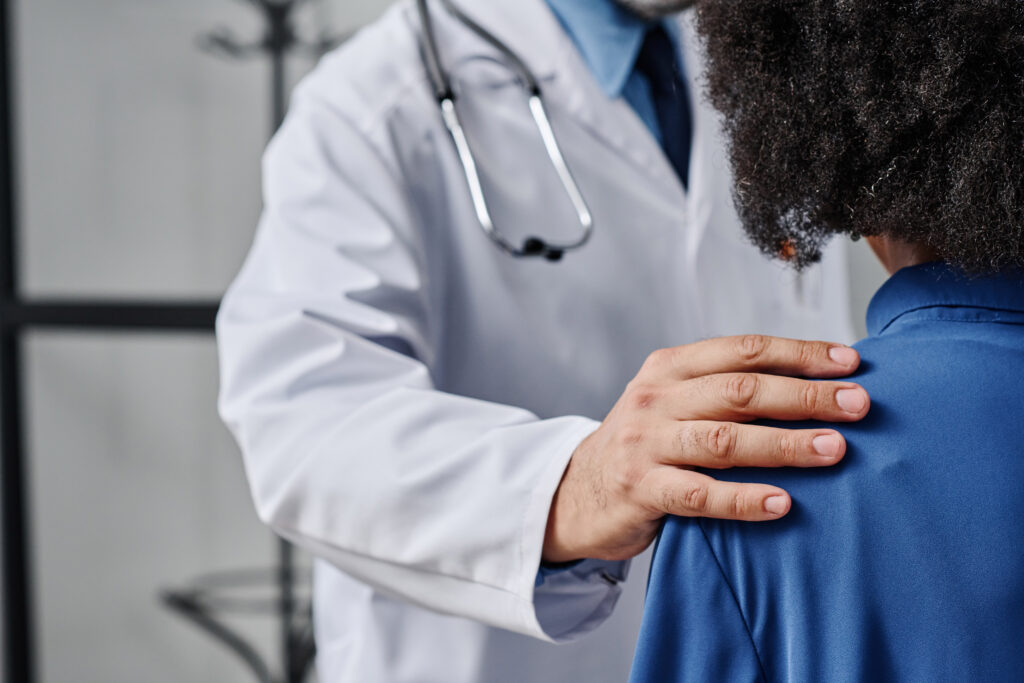 Doctor supporting patient with disease