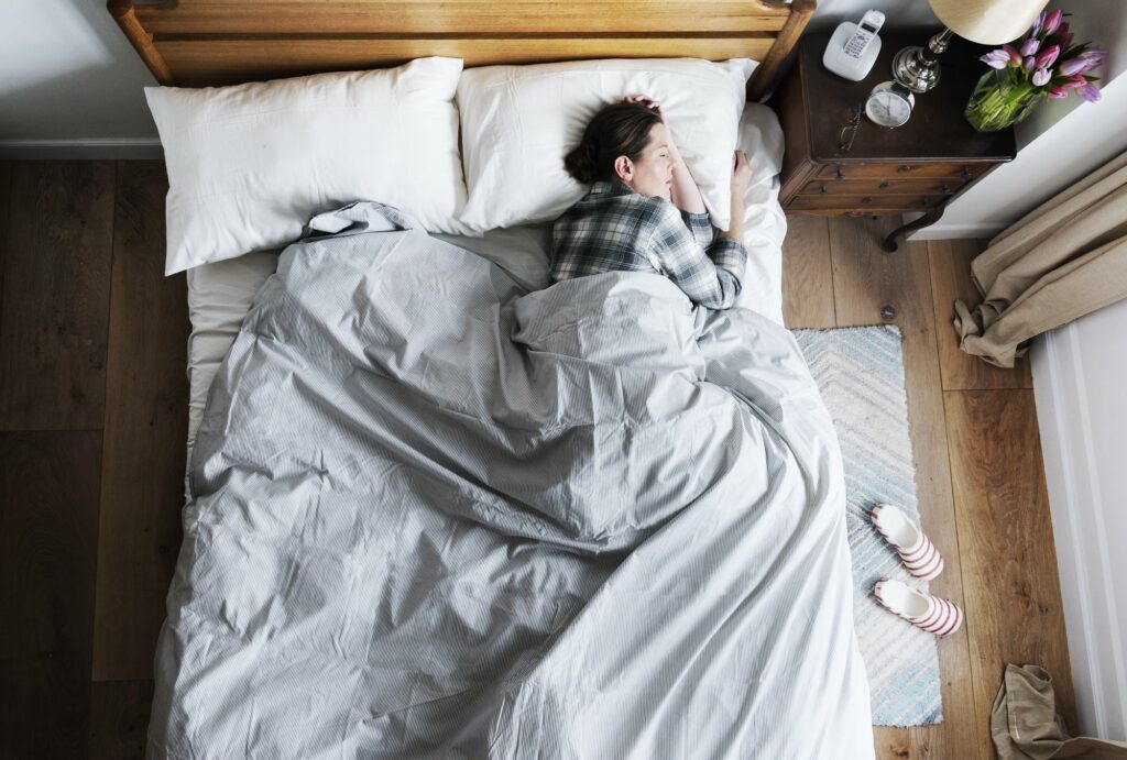 Caucasian woman on bed sleeping