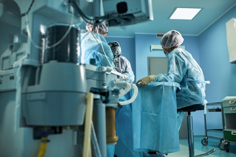 Hospital, surgical operating room. Life saving. Ventilation of the lungs with oxygen. Against the