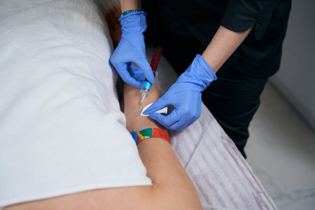 Nurse taking blood for blood test in hospital