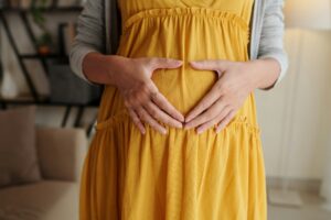 Pregnant woman expecting her baby with love