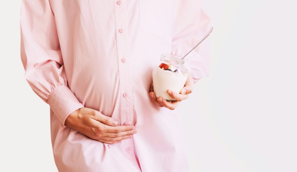 Nutrition during pregnancy. Pregnant woman with healthy food.
