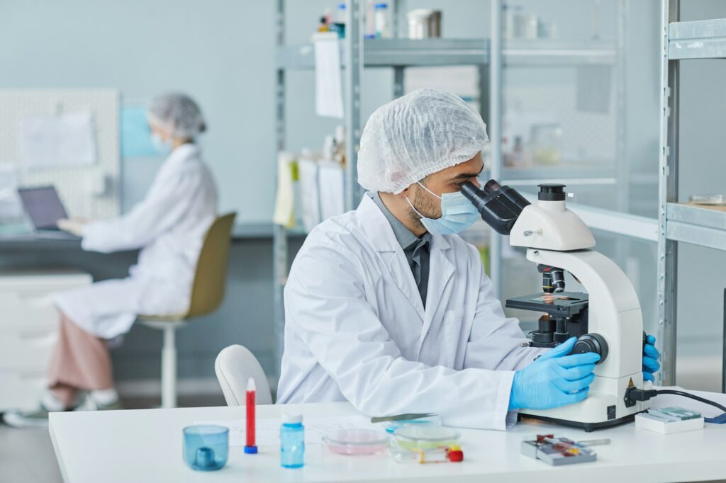 Scientist working with sample of virus in the lab