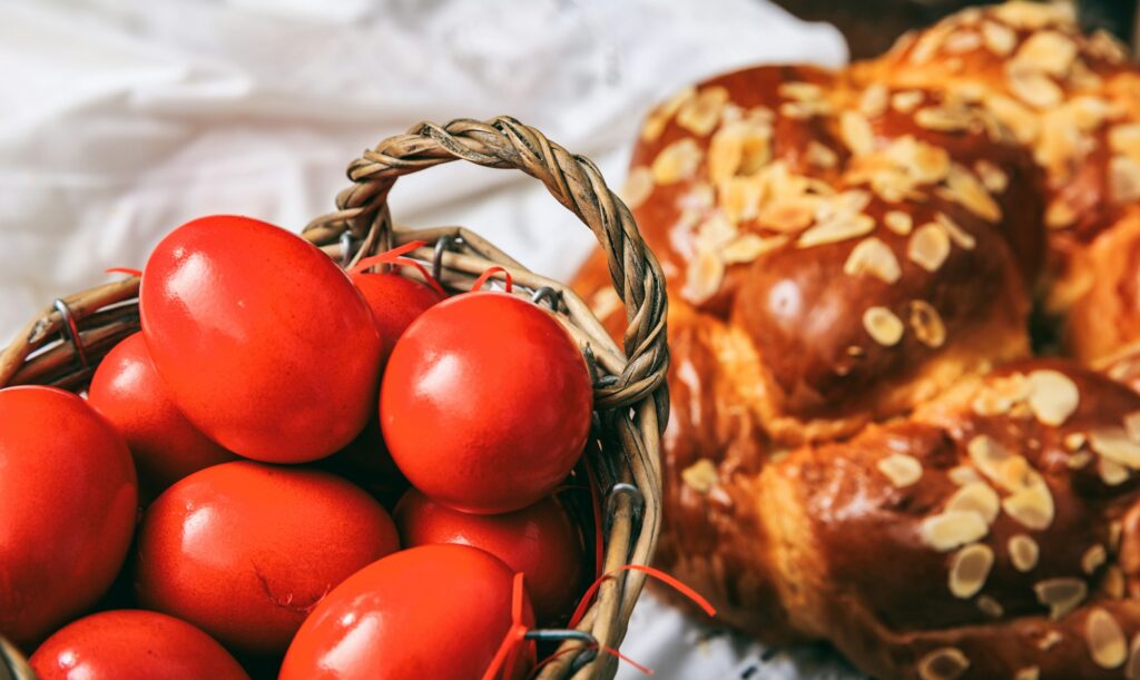 Easter eggs and greek tsoureki on a table