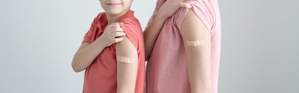 Smiling happy children and teenagers vaccinated against coronavirus infection. Vaccination banner