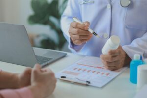 The doctor is explaining the details of the medicine that the patient must take, A patient comes to